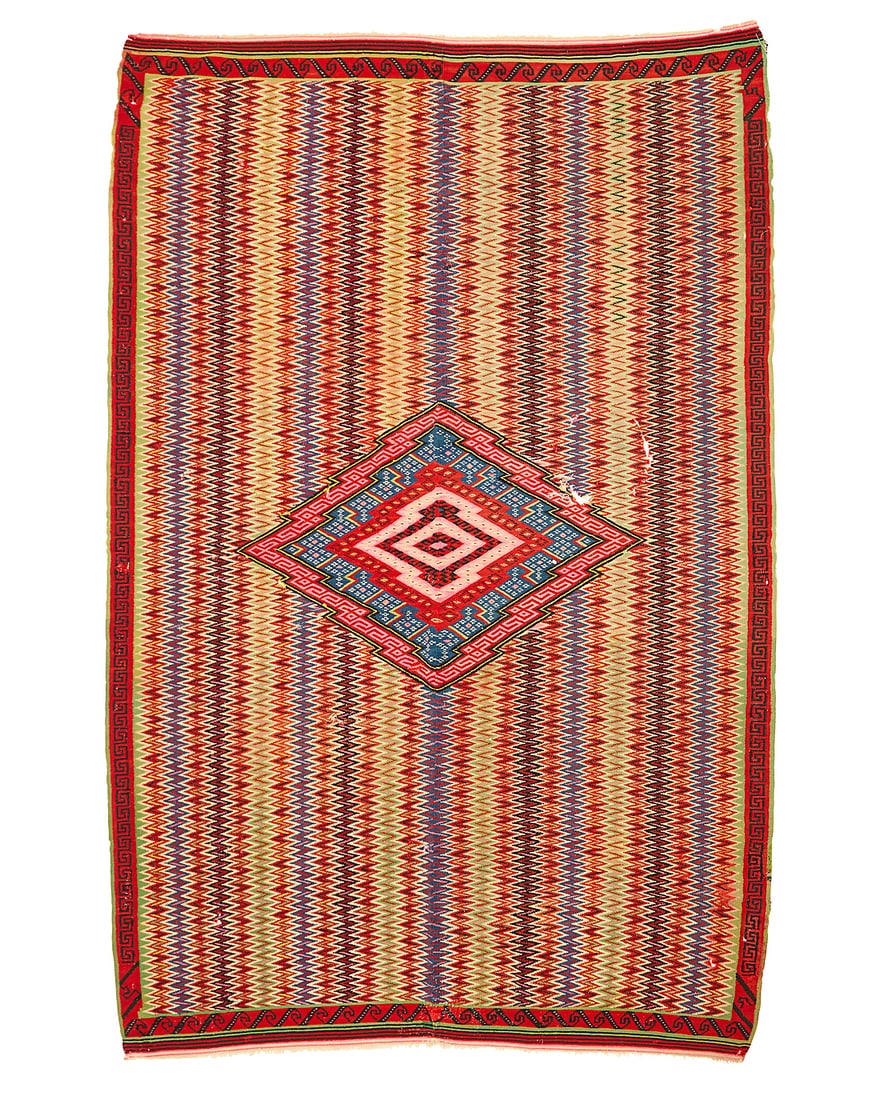 A Mexican Late Classic Saltillo sarape: A Mexican Late Classic Saltillo sarape Circa 1840-1860 Woven in wool in two panels seamed down the middle, with multicolored vertical serrated columns and a concentric-style diamond to center, with na