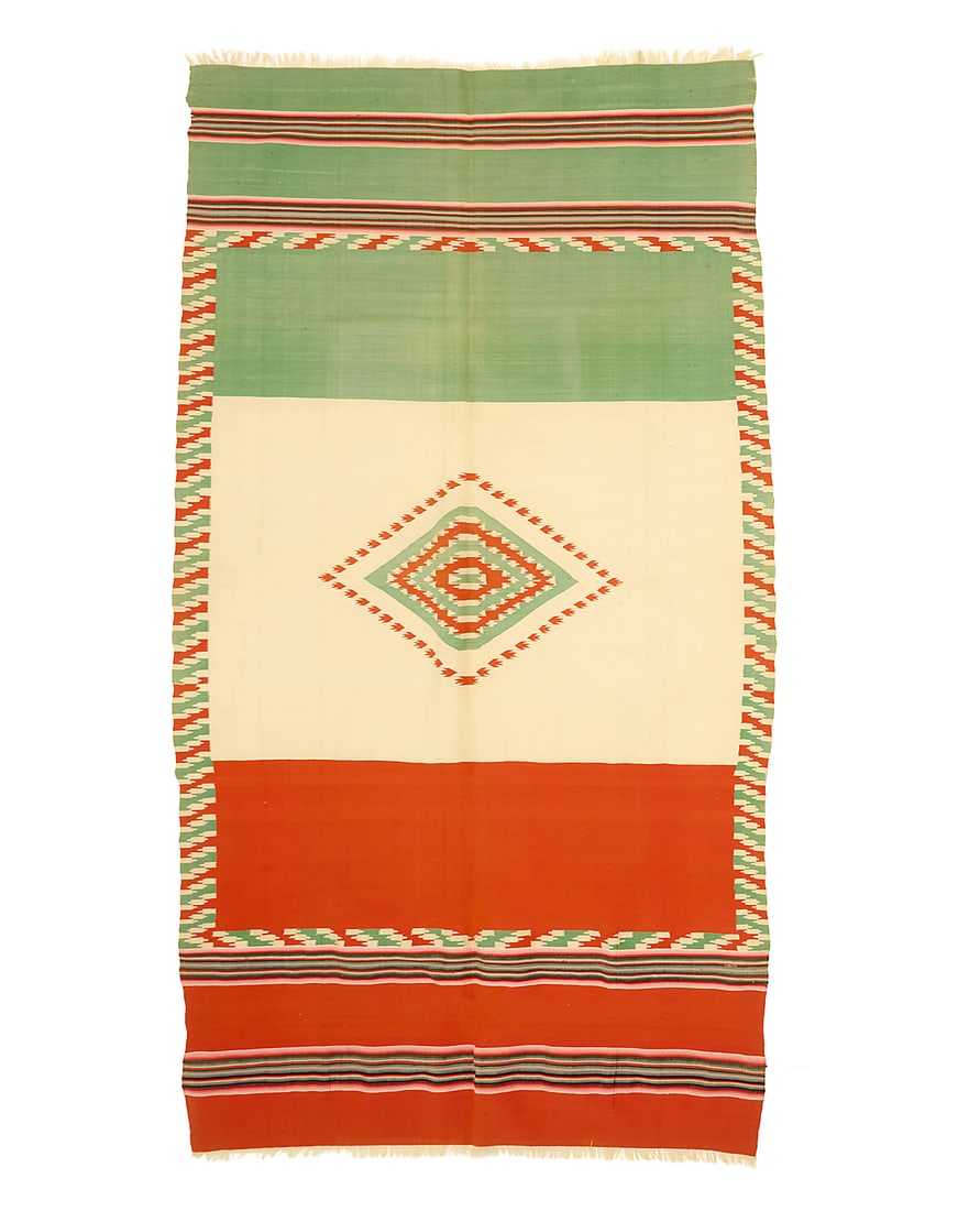 A Mexican Late Maximilian Period Bandera sarape: A Mexican Late Maximilian Period Bandera sarape Circa 1870-1875 A Mexican flag Bandera-style sarape finely woven in orange-red, cream, and green floss wool with a central diamond medallion, an elabora