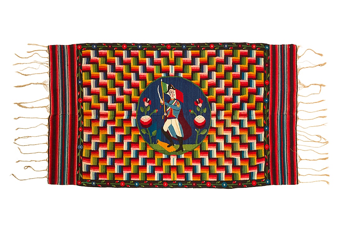 A Mexican Aggregate Period pictorial sarape of Santa Anna: A Mexican Aggregate Period pictorial sarape of Santa Anna Late 19th century Woven with wool weft on cotton warp in tones of blue, green, yellow, and red, in two panels seamed down the middle featuring