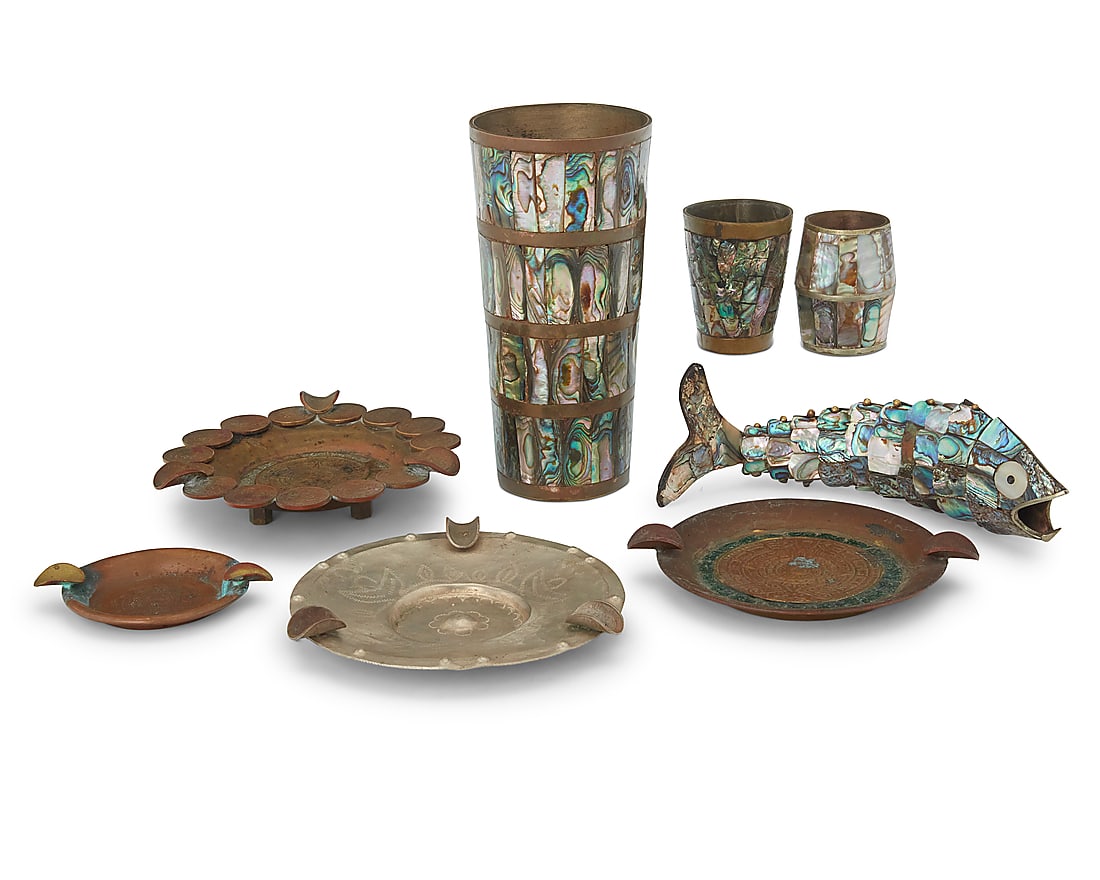 A group of Mexican bar articles: A group of Mexican bar articles Early/mid-20th century Tumbler impressed: MADE IN MEXICO / [indecipherable] TAXCO; one shot glass impressed: ALPACA Comprising a tumbler, two shot glasses, and an