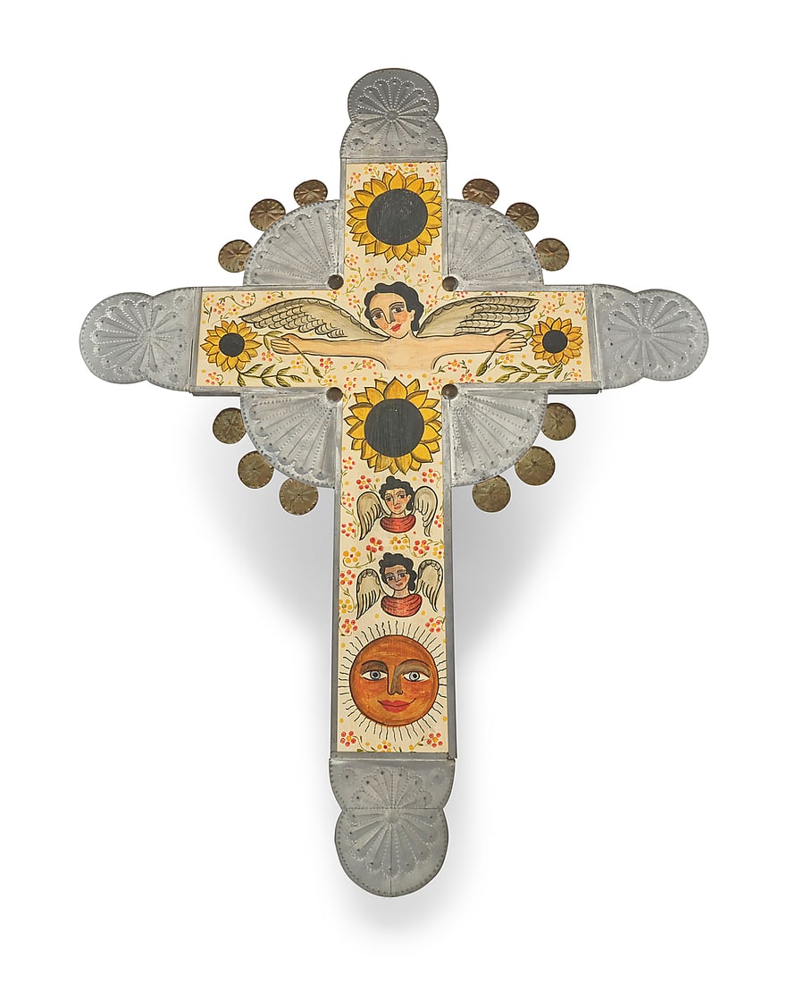 Marie Romero Cash (b. 1942, Hispanic), A painted wood and chased tin cross, 1994: Marie Romero Cash (b. 1942, Hispanic) A painted wood and chased tin cross, 1994 Signed and dated verso: Marie Romero (cash) / 9/94 Depicting a winged figure flanked by sunflowers above two cherubs and