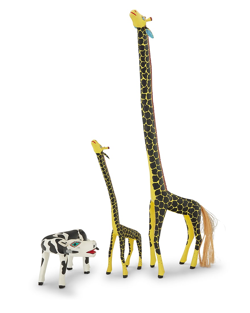 Three Mexican polychrome wood alebrijes: Three Mexican polychrome wood alebrijes Late 20th/early 21st century; Oaxaca, Mexico Each giraffe signed and inscribed: Coindo Melchor G / Oaxaca Mexico. The vibrantly painted folk art figures, compri
