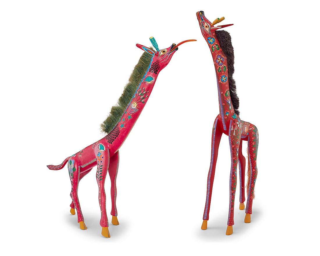 Two Mexican polychrome wood giraffe alebrijes: Two Mexican polychrome wood giraffe alebrijes Late 20th century; Oaxaca, Mexico One signed and inscribed: HECHO POR / JACOBO ANGELES OJEDA / SN. Martin Tilcajete / OCOTLAN OAXACA / 1998 / Mexico / IND