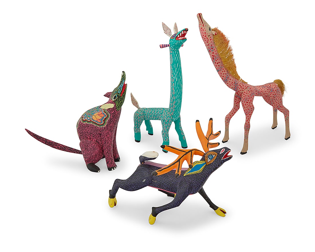 Four Mexican polychrome wood alebrijes: Four Mexican polychrome wood alebrijes Late 20th/early 21st century; Oaxaca, Mexico Antlered signed: ELEAZAR / MORALES; taller giraffe inscribed: TRIBUS. MIXES [Noel and Neftali Martinez Villanueva] /