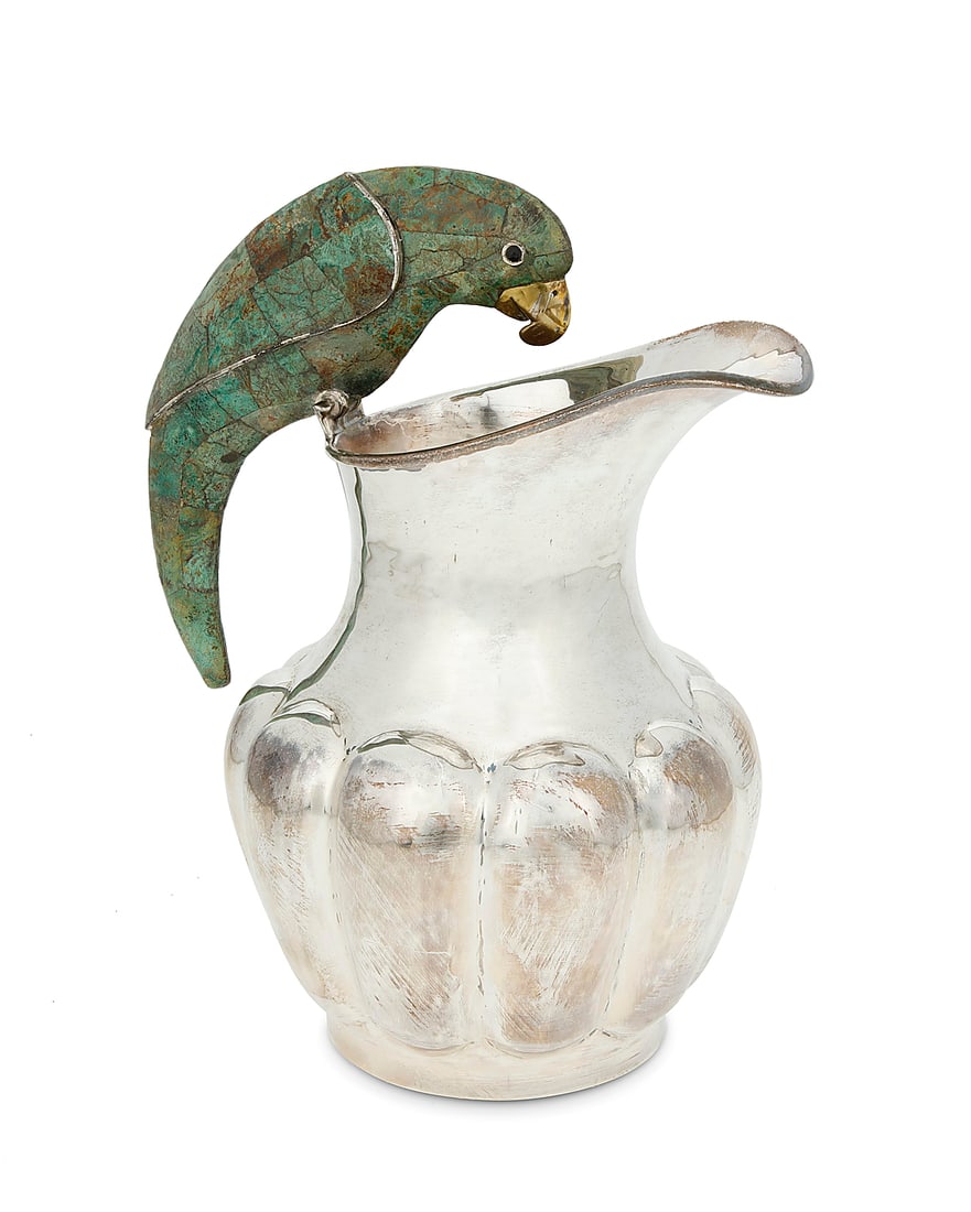A Los Castillo silver-plated figural pitcher: A Los Castillo silver-plated figural pitcher Circa 1939-1962; Taxco, Mexico Impressed to underside: R / LOS CASTILLO TAXCO / TA-01 / PLATEADO Mounted with a green hardstone overlay parrot handle above