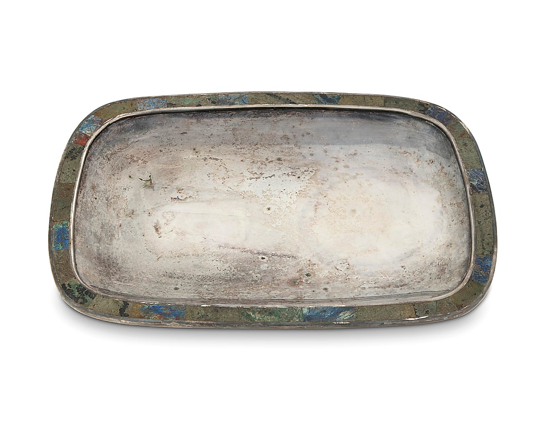 A Los Castillo silver-plated tray: A Los Castillo silver-plated tray Mid-20th century; Taxco, Mexico Impressed to underside: LOS CASTILLO TAXCO / PLATEADO / TA-01 / HECHO EN MEXICO / 108 With hardstone inlaid rim 0.875" H x 11" W x 7.7