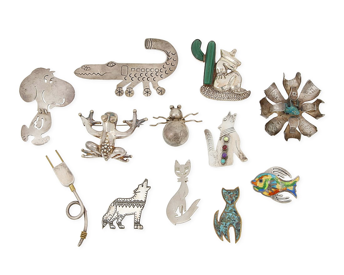 Twelve Mexican-style silver pictorial brooches: Twelve Mexican-style silver pictorial brooches Mid/late-20th century Eleven variously marked for sterling; nine marked for Mexico; eight variously marked for maker: JF [Jeronimo Fuentes] / EFS / HH / 