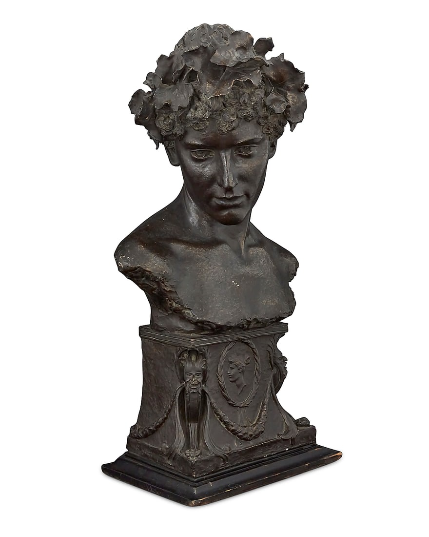 A Continental patinated cast plaster bust First half 20th century Inscribed indistinctly, possibly: A Continental patinated cast plaster bust First half 20th century Inscribed indistinctly, possibly reading: B ANGLE On a wood base Overall: 24.5" H x 13.75" W x 8.5" D