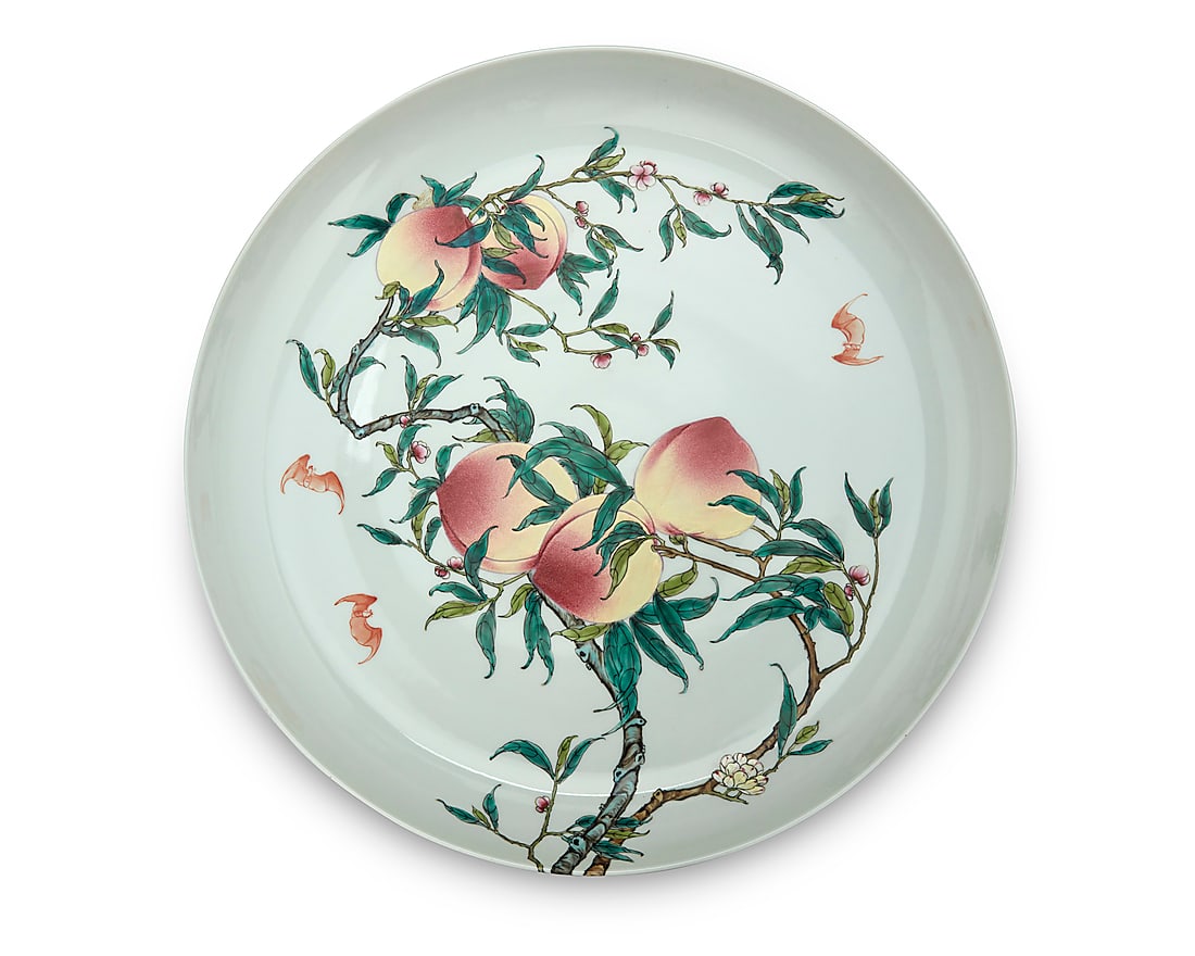 A large Chinese porcelain nine peach charger Likely Republic Period (1912-1949) or later Bearing: A large Chinese porcelain nine peach charger Likely Republic Period (1912-1949) or later Bearing an apocryphal reign mark for Yongzheng Period (1723-1735) Depicting five peaches to interior and four t