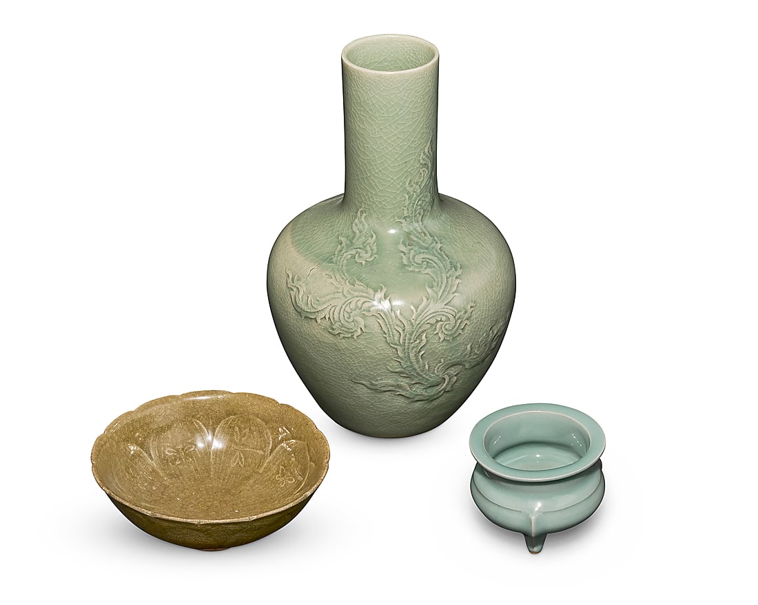 A group of Chinese style celadon porcelain vessels 20th/21st century Vase with indecipherable: A group of Chinese style celadon porcelain vessels 20th/21st century Vase with indecipherable impressed marks and signature Comprising a vase with foliate scroll motif in low relief, a footed lotus bo