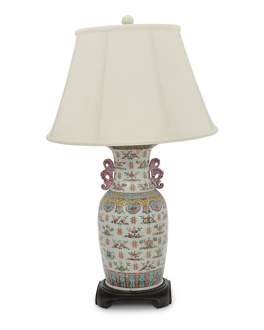 A Chinese Famille Rose porcelain vase as a lamp 20th century With bat-form handles, decorated with: A Chinese Famille Rose porcelain vase as a lamp 20th century With bat-form handles, decorated with bundles of nine peaches and floral motifs, mounted as a table lamp with single light, surmounted by a