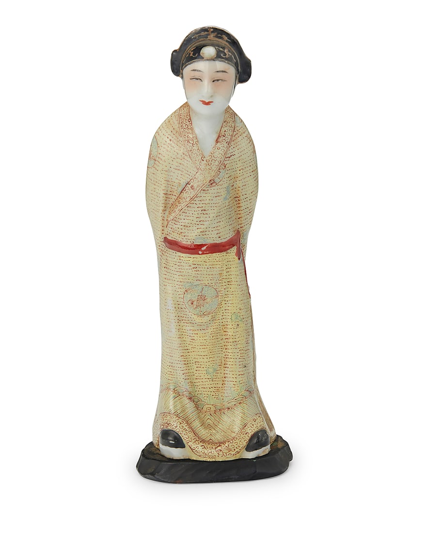 A Chinese Export polychrome porcelain figure of a young scholar Late Qing Dynasty/Republic Period: A Chinese Export polychrome porcelain figure of a young scholar Late Qing Dynasty/Republic Period (1644-1949) or later Stamped to underside: CHINA Depicted in a bowing pose with hands clasped behind b