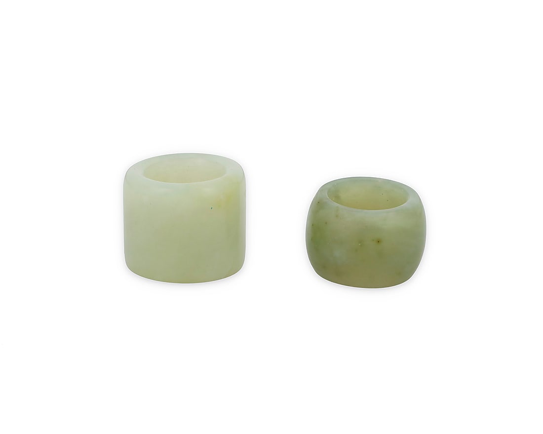 Two Chinese hardstone archery thumb rings 20th century or earlier 2 pieces Larger: 1.25" H x: Two Chinese hardstone archery thumb rings 20th century or earlier 2 pieces Larger: 1.25" H x 1.375" Dia., inner 0.875" Dia.; Smaller: 1" H x 1.375" Dia., inner: 0.75" Dia.