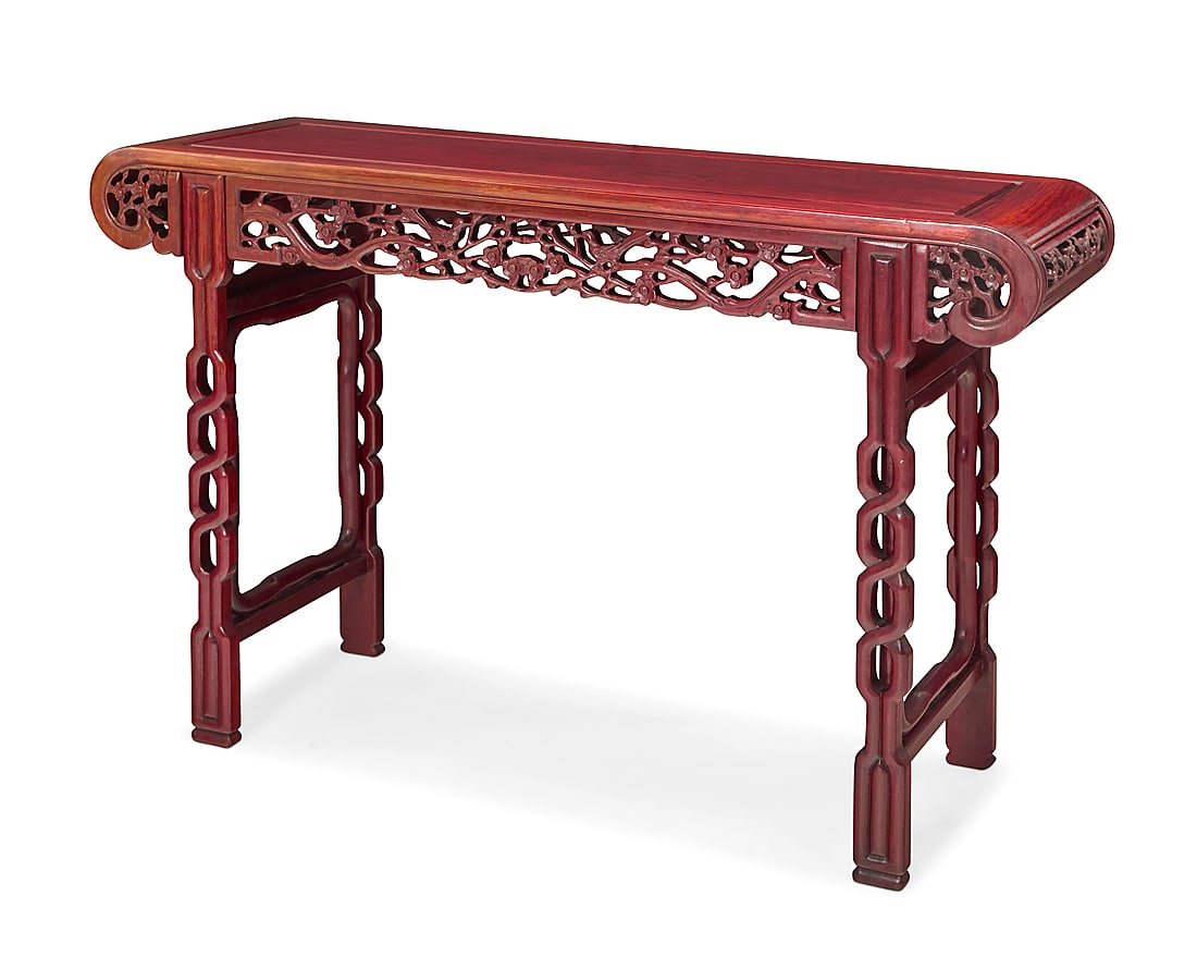 Y A Chinese carved rosewood altar table 20th century The apron carved with openwork tree branches: Y A Chinese carved rosewood altar table 20th century The apron carved with openwork tree branches and birds 32.25" H x 48.75" W x 15" D This lot may require a CITES permit if being shipped outside Cal