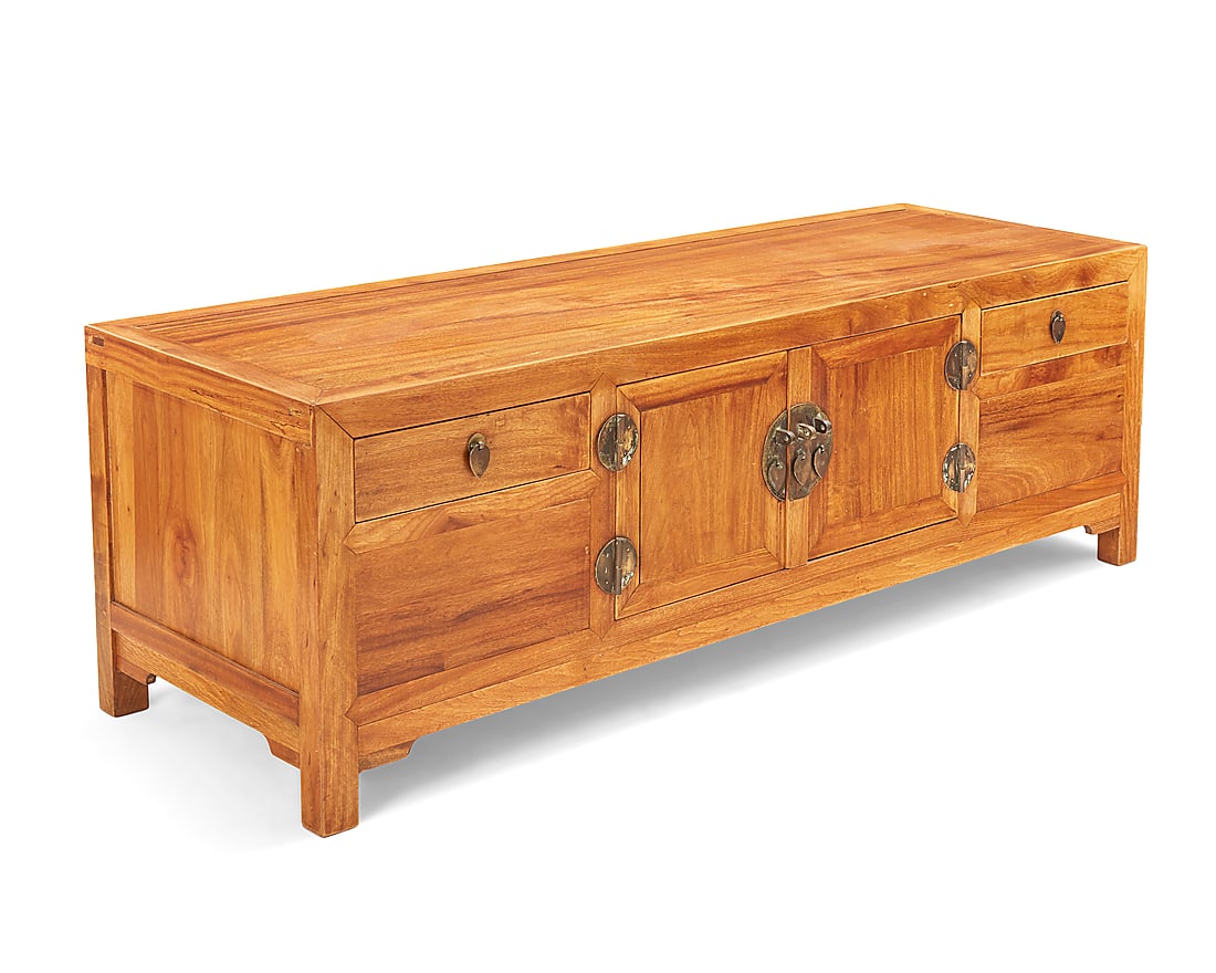 A Chinese elmwood low cabinet 20th century The case centered by a central cupboard flanked by: A Chinese elmwood low cabinet 20th century The case centered by a central cupboard flanked by single drawers 19.75" H x 59" W x 19.5" D