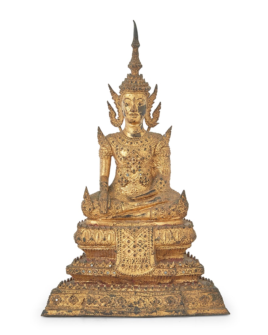 A Burmo Thai gilt metal Buddha figure Rattanakosin Period (1782-1932) With inset glass accents,: A Burmo Thai gilt metal Buddha figure Rattanakosin Period (1782-1932) With inset glass accents, depicted with hands in bhumisparsha mudra, seated on a tiered base 11.75" H x 7.375" W x 5" D