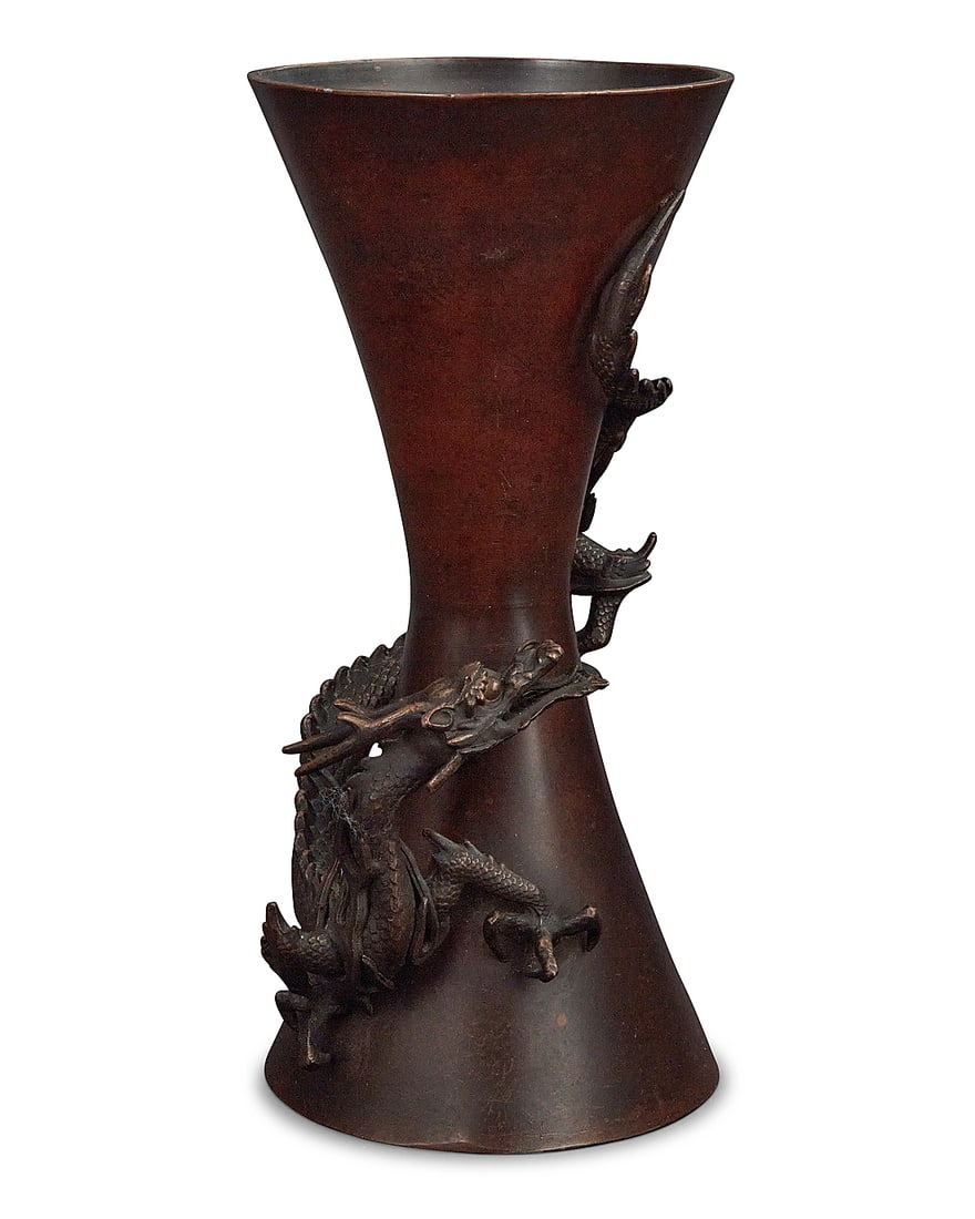 A Japanese bronze dragon vase 20th century With impressed seal mark to underside The hourglass: A Japanese bronze dragon vase 20th century With impressed seal mark to underside The hourglass vase with applied dragon form to conical vase 9.375" H x 4.5" W x 4.25" D Provenance: Sold: Abell Auction