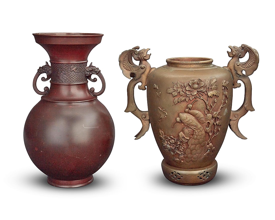 Two Japanese metal vases 20th century Comprising one patinated copper with beast mask handles, and: Two Japanese metal vases 20th century Comprising one patinated copper with beast mask handles, and one brass with phoenix handles, depicting avian motifs in relief to body above an openwork base 2 pie