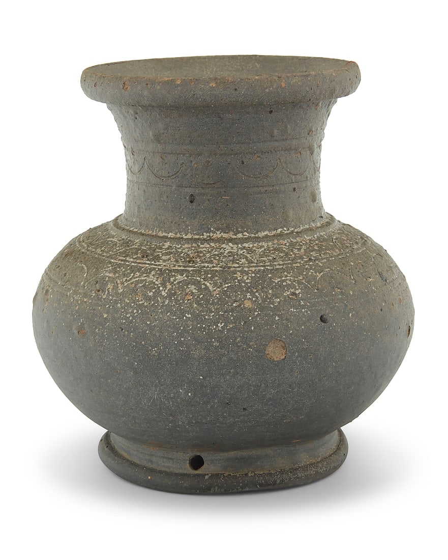 A Korean black stoneware vessel: A Korean black stoneware vessel Silla Dynasty (57 BCE-935 CE) With bands of incised decorations to shoulder and neck 5.375" H x 4.875" Dia. Provenance: Private collector, San Francisco, CA By family