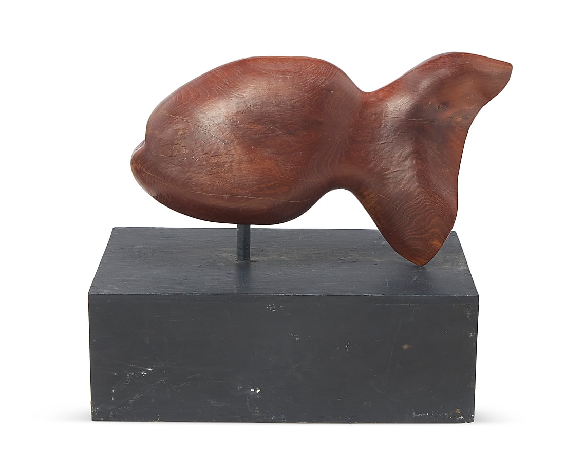 A carved wood model of a fish: A carved wood model of a fish Mid/late 20th century With carved signature: R. Stein Fish: 11.75" H x 20.75" W x 5.5" D; Base: 7.25" H x 20.25" W x 12" D Provenance: Private estate, California