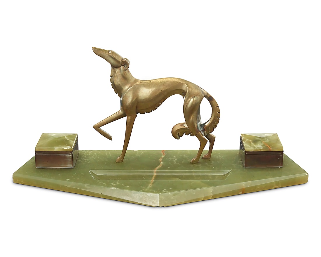 An Art Deco bronze and onyx figural encrier: An Art Deco bronze and onyx figural encrier Circa 1925 With a bronze greyhound figure mounted to an onyx base with two inkwells Overall: 8.5" H x 19.5" W x 6.875" D Provenance: Sold: Bonhams, Los