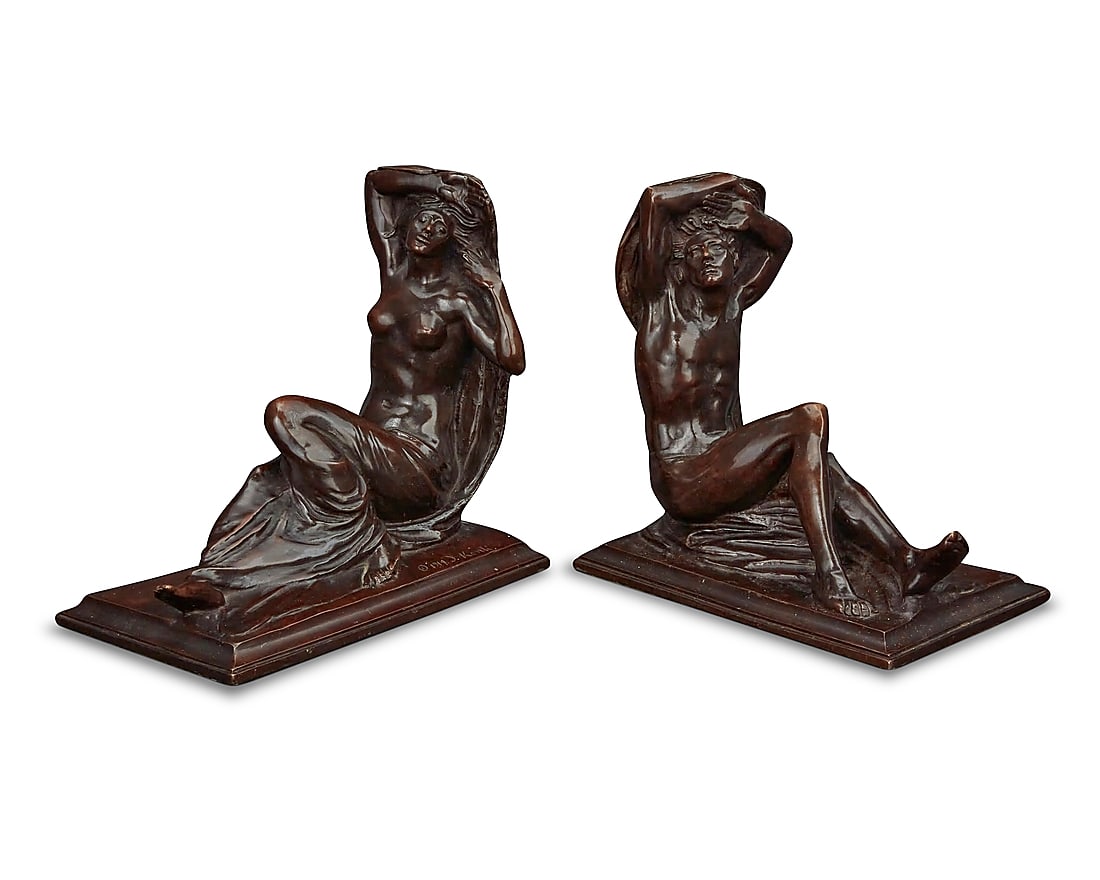 Isidore Konti (1862-1938), A near pair of patinated bronze figural bookends, 1914 (1 of 6)
