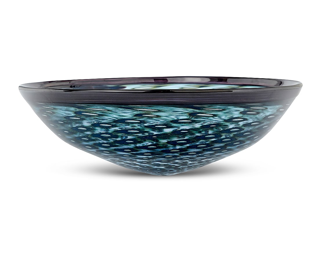 A Modern art glass bowl: A Modern art glass bowl 1999 Etched with indistinct signature and dated With geometric diamond-shaped forms arranged in a swirling optic pattern Height 5 in., diameter 14 3/8 in. Provenance: Private c
