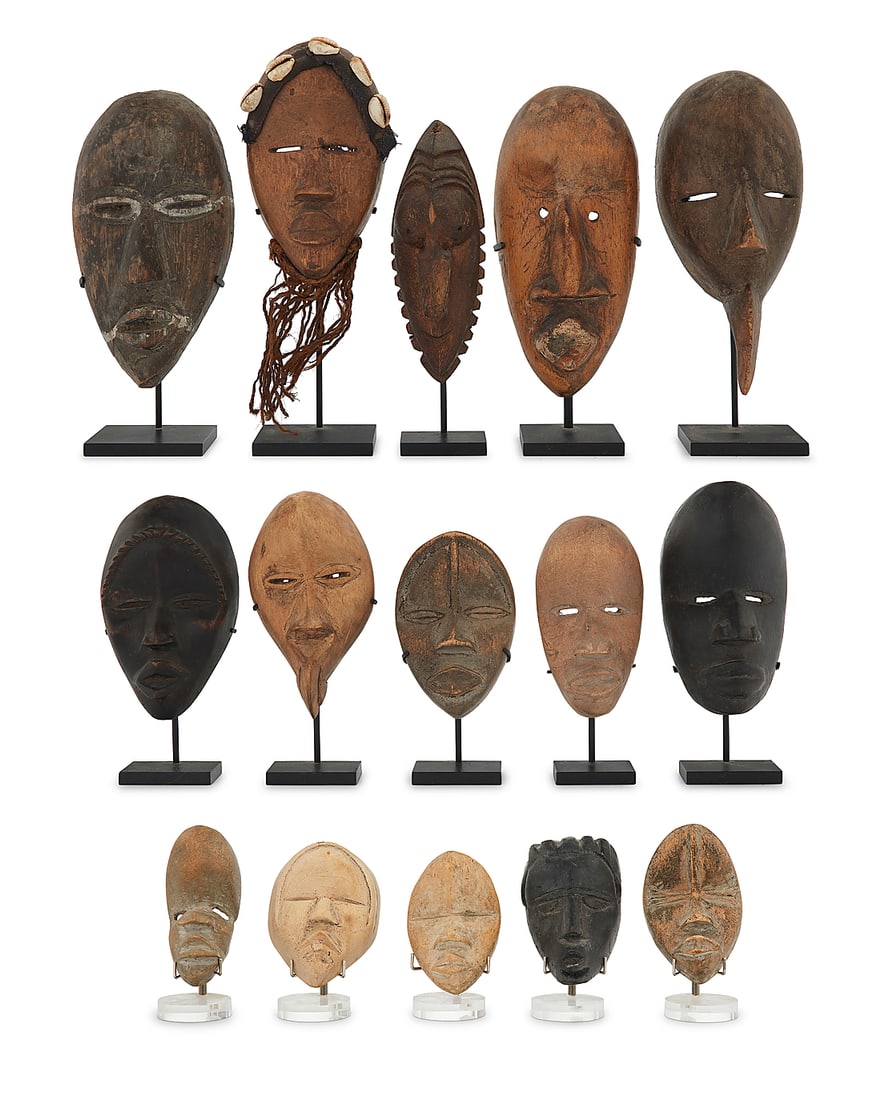 A group of West African carved wood dan masks (1 of 7)