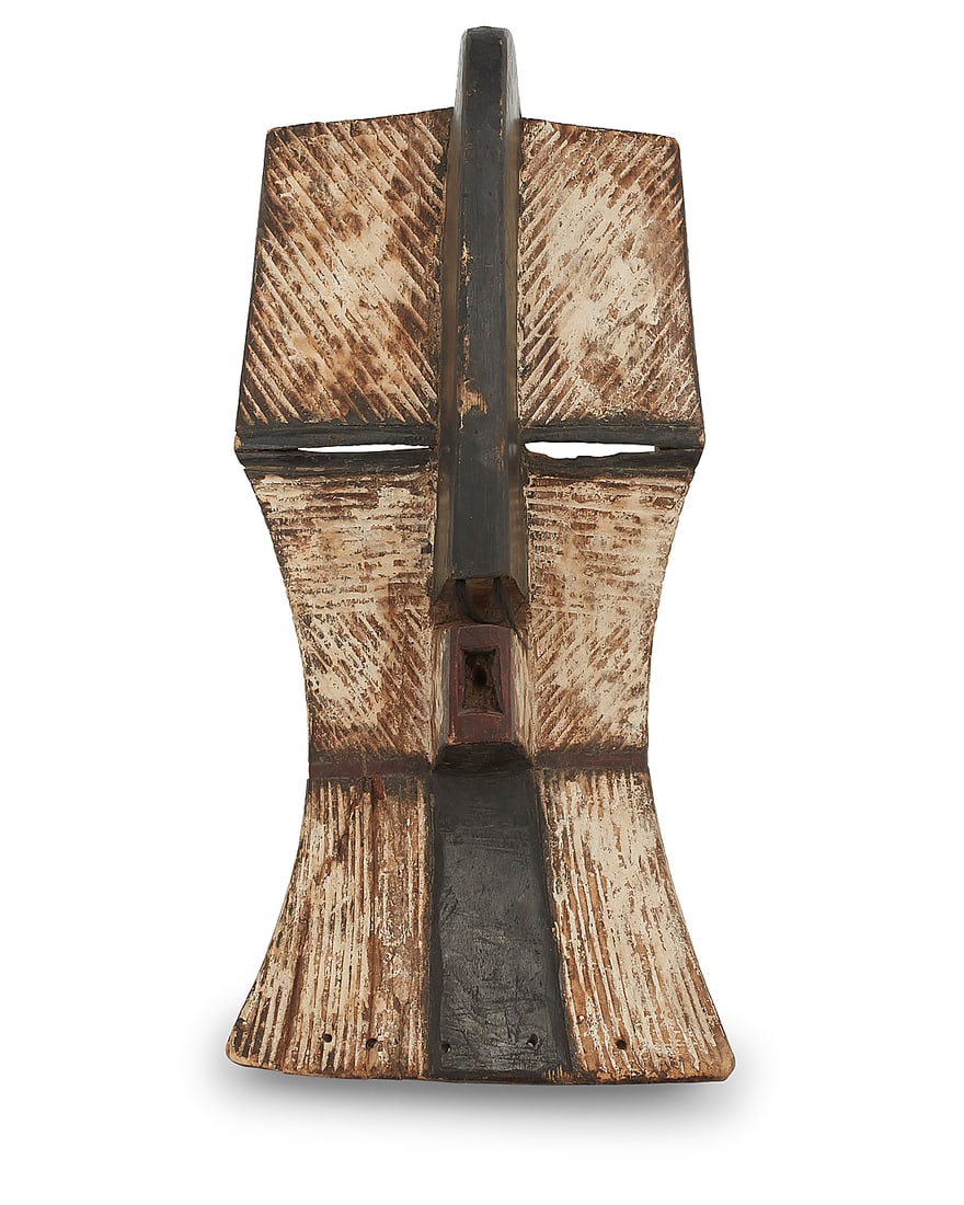 An African Kifwebe carved wood mask: An African Kifwebe carved wood mask 20th century, Luba or Songye; Democratic Republic of the Congo Incised and pigmented wood Height 27 in., width 12 1/4 in., depth 9 in.