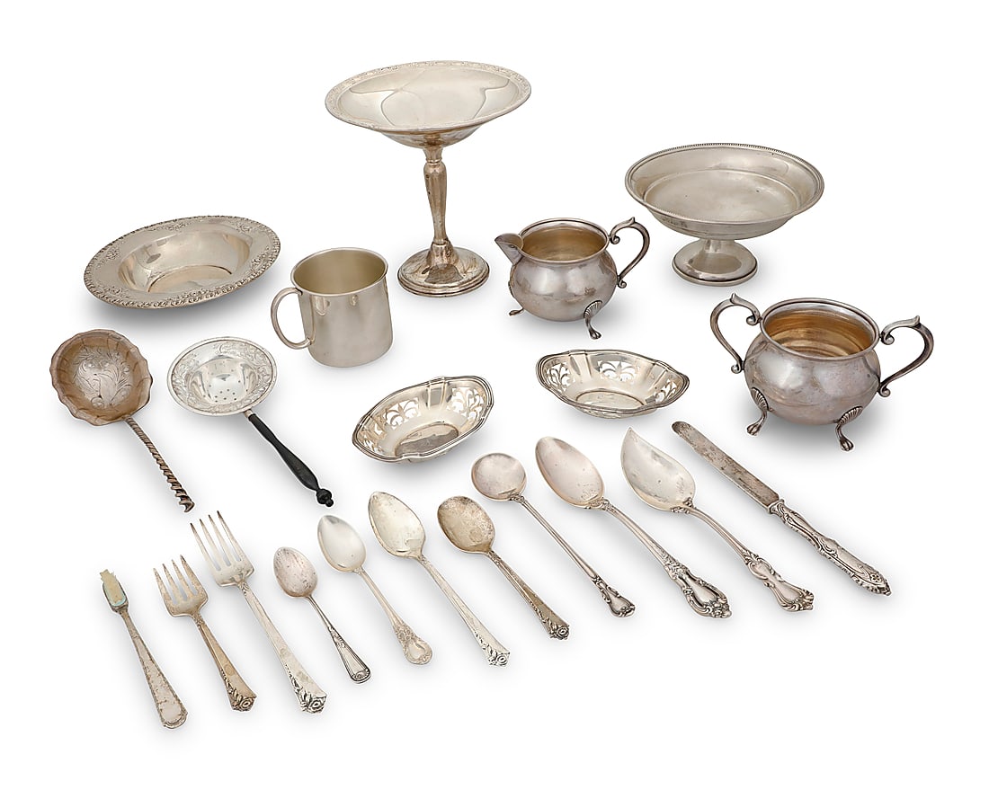 A group of sterling silver table items: A group of sterling silver table items 20th century Each marked with factory marks for sterling Comprising an open sugar, creamer, cup, bowl, two nut dishes, various utensils, and a weighted sterling 