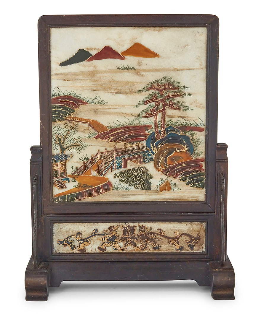 A Chinese polychrome and gilt marble table screen: A Chinese polychrome and gilt marble table screen 20th century Depicting a landscape, framed and raised in a carved wood stand Height 14 3/8 in., width 10 5/8 in., depth 4 1/2 in.