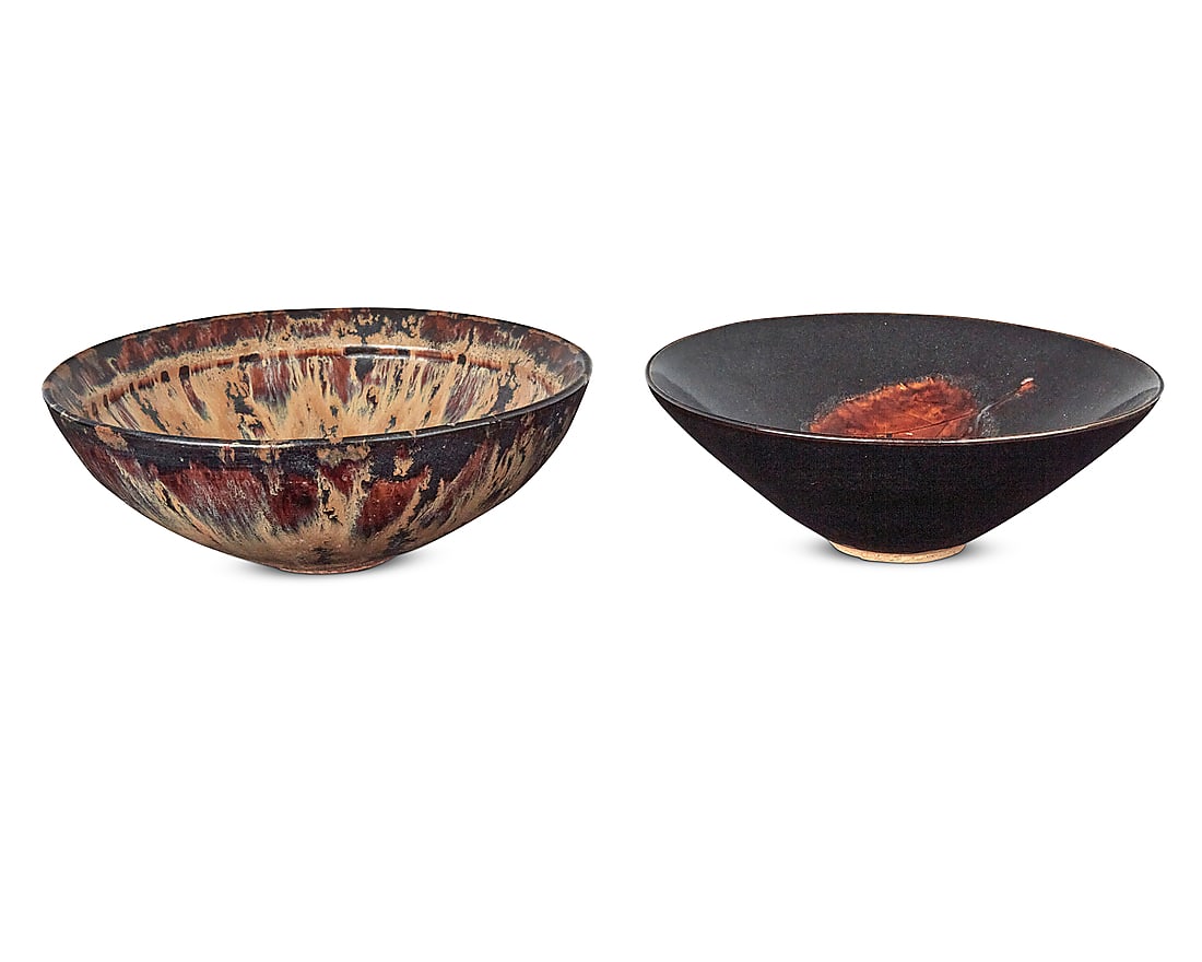 Two Chinese glazed pottery bowls: Two Chinese glazed pottery bowls 20th century Each with applied wax export seal to underside Comprising one flambe glazed and one Jizhou-style oxblood glazed decorated with burnt leaf resist 2 pieces 