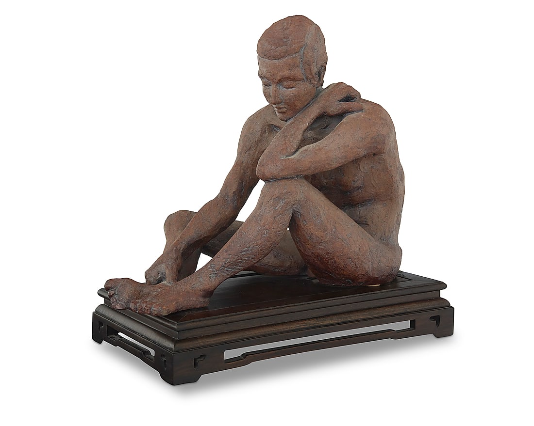 A glazed stoneware figural sculpture: A glazed stoneware figural sculpture Late 20th/early 21st century Incised signature: R. LASSER With bronze-toned matte glaze, raised on an associated wood plinth Figure height 12 1/2 in., width 9 1/2 