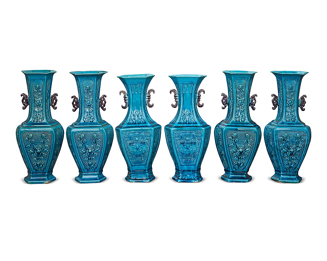 A group of six Chinese turquoise glazed pottery archaistic vases: A group of six Chinese turquoise glazed pottery archaistic vases 20th century Each stamped to underside: MADE IN CHINA Comprising a set of four decorated with floral motifs in low relief, and a pair w