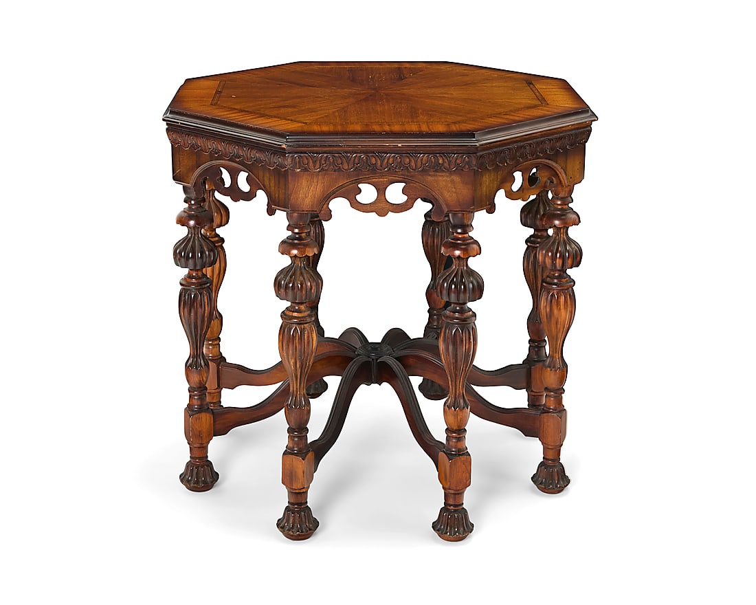 A Brandt Furniture Co. octagonal walnut side table: A Brandt Furniture Co. octagonal walnut side table Circa 1920s Partial paper label applied to underside With veneered top above an openwork apron, raised on turned legs joined by eight curved
