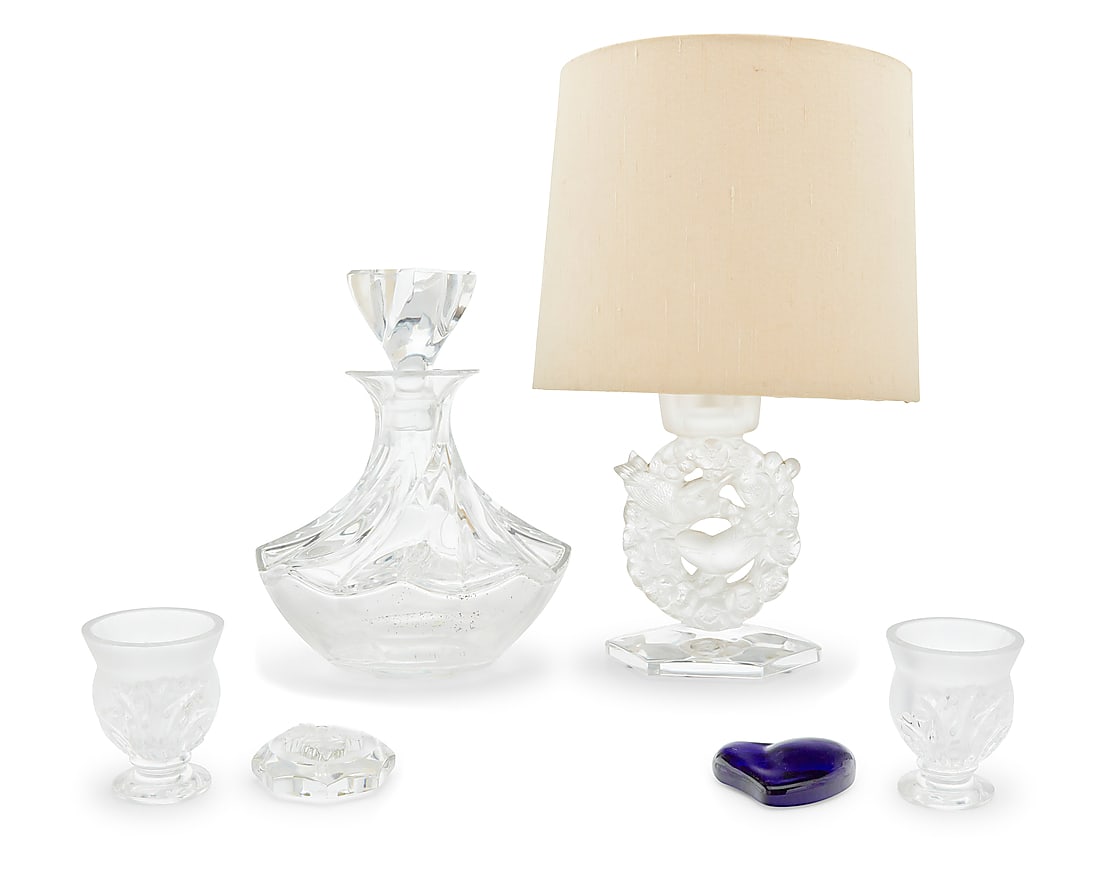 Five Lalique glass table items: Five Lalique glass table items Late 20th/early 21st century Each etched to underside: Lalique ® France Comprising a 'Mesanges' lamp, 'Aberdeen Swirl' decanter, pair of 'Saint Cloud' cigarette urns, a