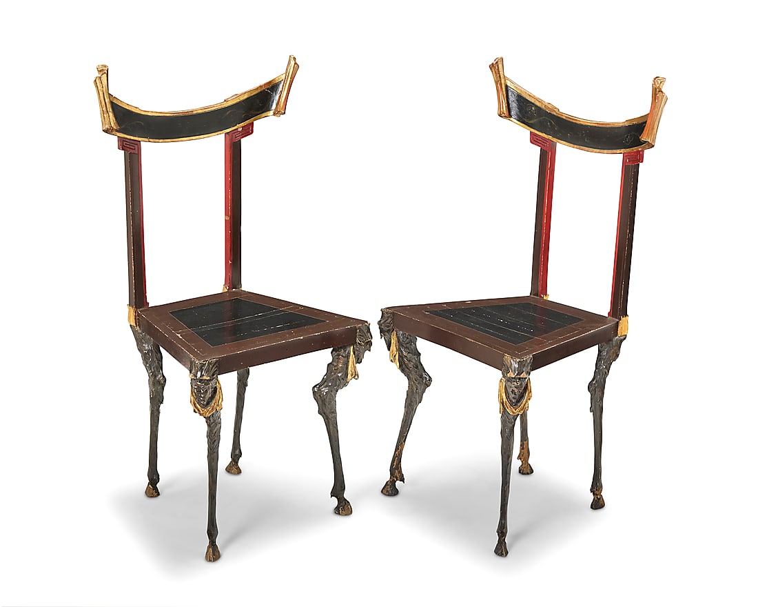 A pair of Surrealist style side chairs: A pair of Surrealist style side chairs 20th century Each parcel-gilt crest rail with scrolled ends, raised on goat-leg-form feet, with beast masks at the front corners 2 pieces Height of each 35 1/4