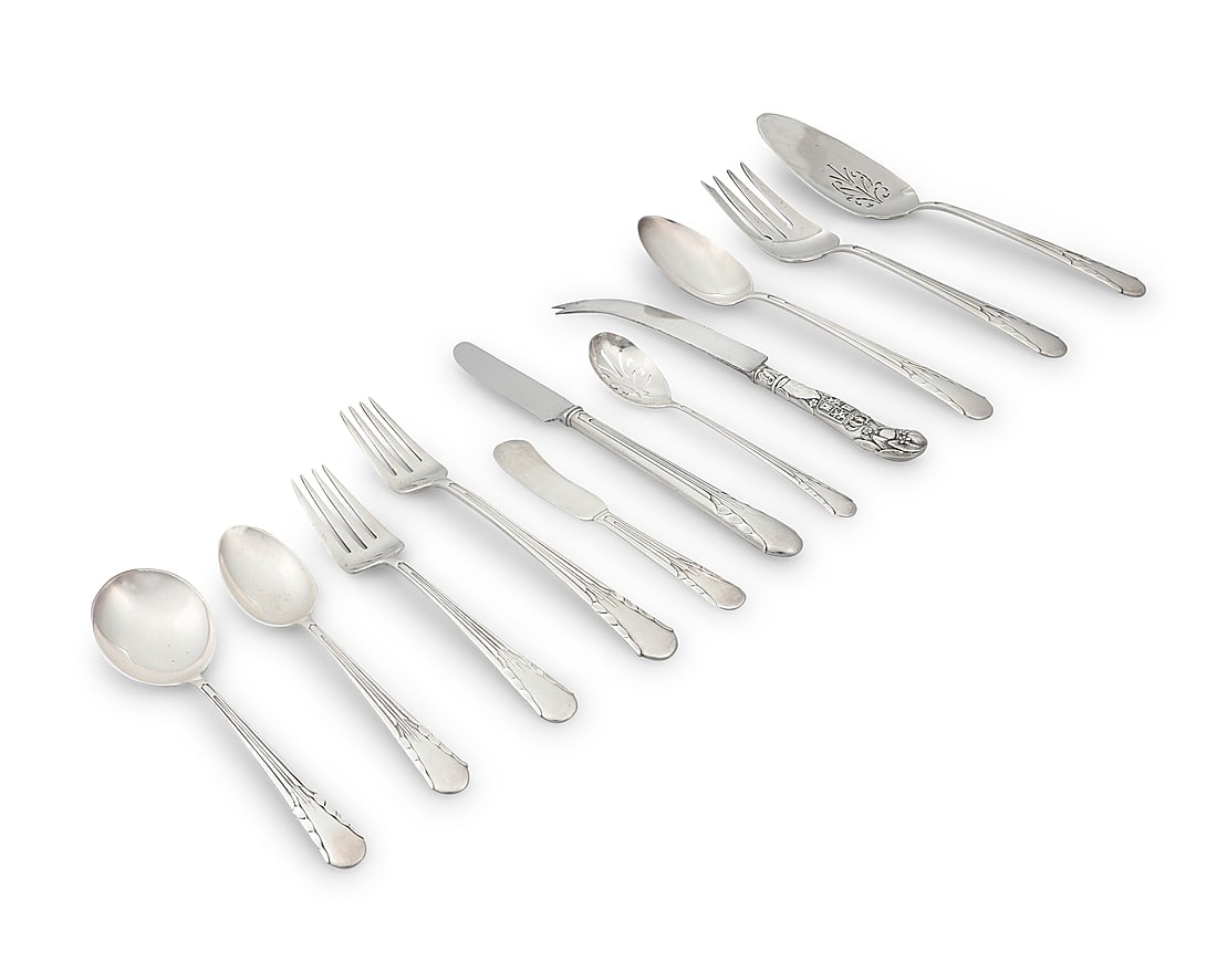 An International sterling silver 'Orchid' part flatware service: An International sterling silver 'Orchid' part flatware service Mid-20th century Designed 1929 Each with factory marks for sterling Comprising: 5 dinner knives (8 1/2 in.) 11 butter spreaders (5 3/4 i