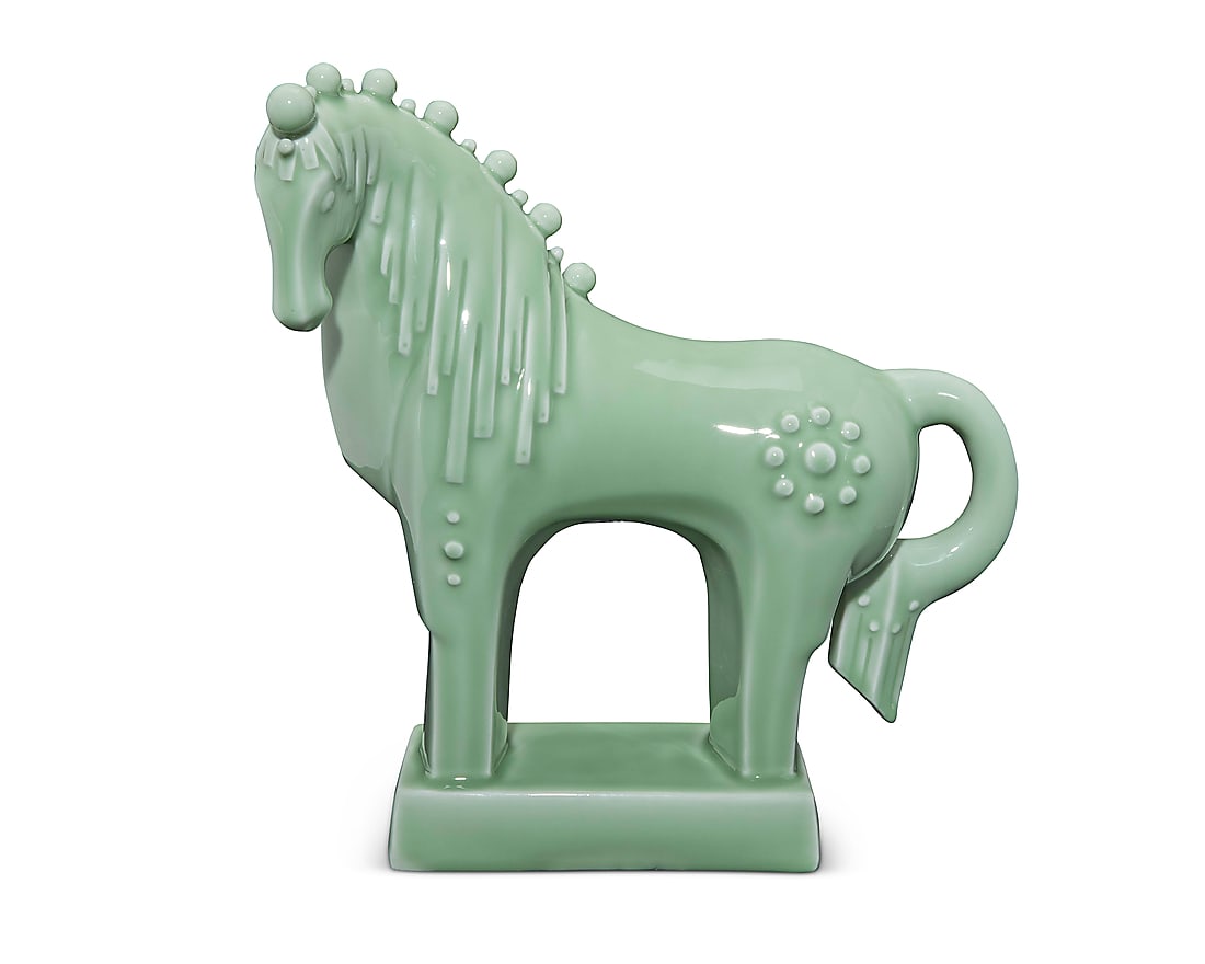 A Chinese glazed porcelain figure of a horse: A Chinese glazed porcelain figure of a horse Early 21st century With stamped signature and other indecipherable maker's marks to underside In the style of a contemporary Tang-style horse Height 16