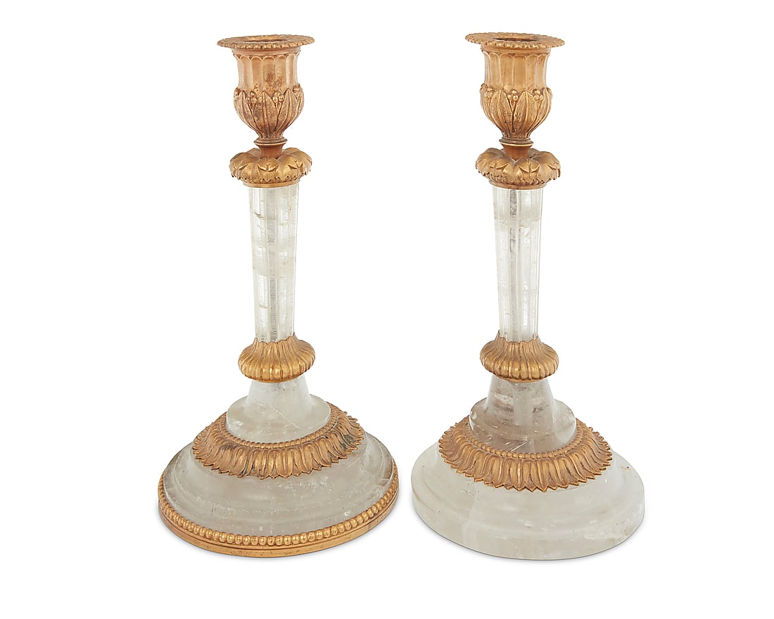 A pair of gilt bronze mounted rock crystal candlesticks: A pair of gilt bronze mounted rock crystal candlesticks Late 20th century With foliate-form mounts 2 pieces Height of each 7 3/4 in., diameter 4 in.
