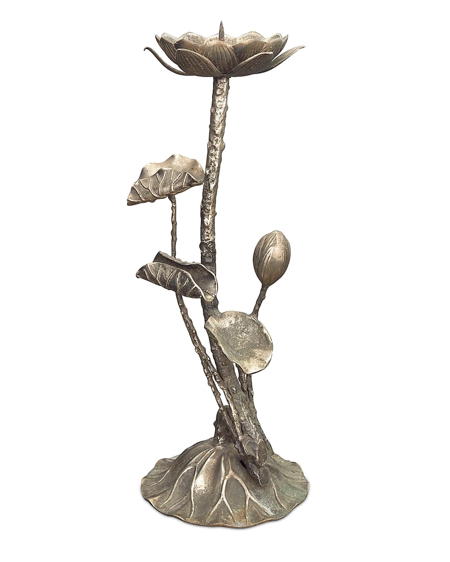 A Japanese silvered brass lotus blossom candle holder: A Japanese silvered brass lotus blossom candle holder 20th century Impressed to underside: JAPAN The stem-form standard issuing a single central light Height 20 1/8 in., width 8 3/8 in., depth 7 3/8
