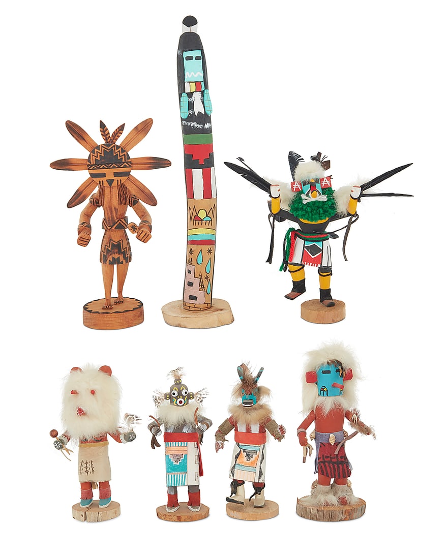 Seven Southwest polychrome katsina carvings: Seven Southwest polychrome katsina carvings Second half 20th century A group of katsina figures in various sizes including a Hopi Maiden 'Rain' kachina by Bruce Harvey, a Sunface figure by D.
