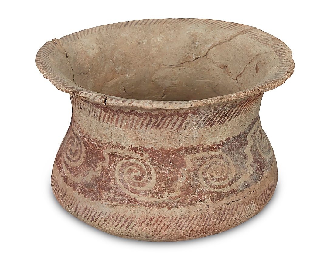 A Hohokam red on white pottery jar: A Hohokam red on white pottery jar 8th-15th century CE Painted with red bands of hash marks centering a band of repeated swirling and stepped motifs on white buff slip ground Height 5 3/4 in., width