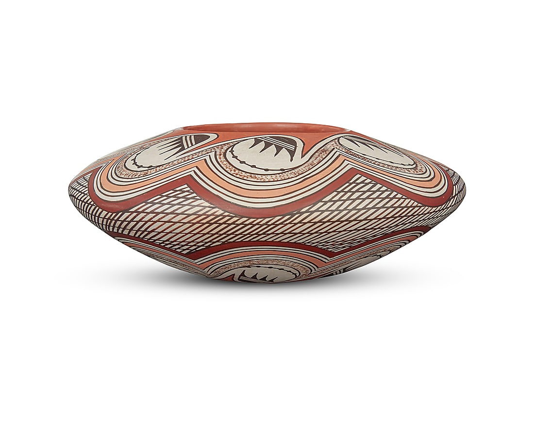 Helen Naha (Feather Woman) (1922-1993, Hopi-Tewa), A polychrome pottery low jar: Helen Naha (Feather Woman) (1922-1993, Hopi-Tewa) A polychrome pottery low jar With wide shoulder, decorated with tan, brown, ochre, and black banded migration motif to shoulder and lower body, on