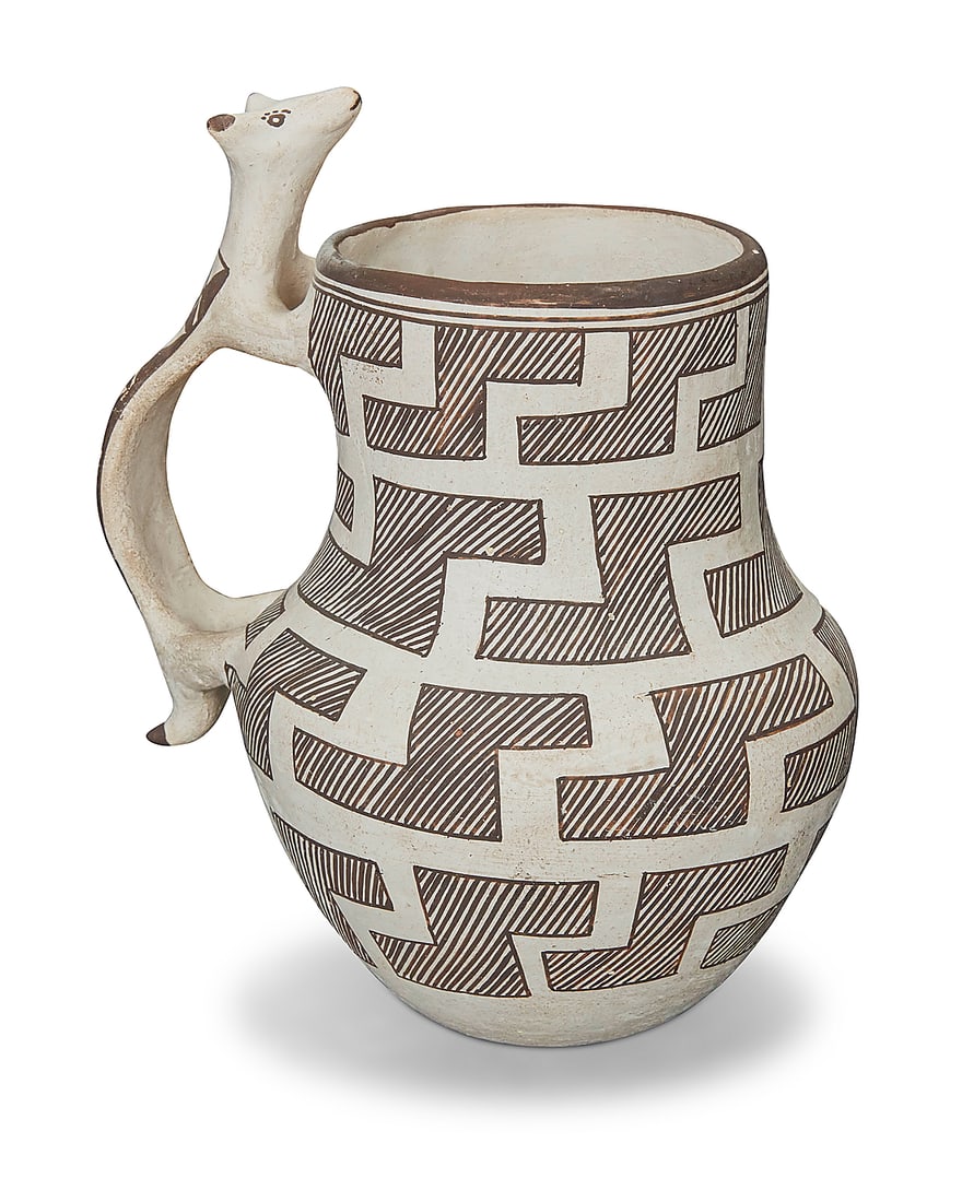 Marie Z. Chino (1907-1982, Acoma Pueblo), A pottery effigy water pitcher: Marie Z. Chino (1907-1982, Acoma Pueblo) A pottery effigy water pitcher With figurative handle decorated with fine-line black Anasazi Revival stepped design on white slip ground Signed to the