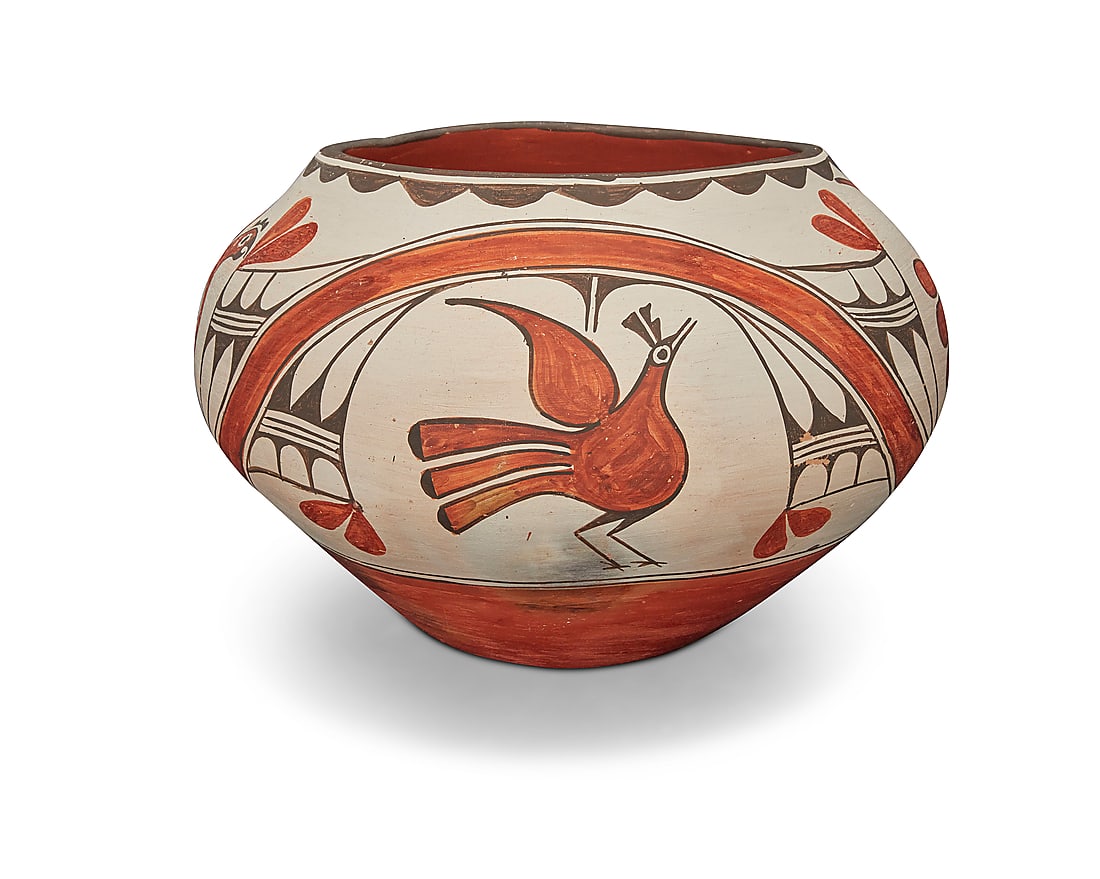 Seferina Bell (1920-1986, Zia Pueblo), A large polychrome globular jar: Seferina Bell (1920-1986, Zia Pueblo) A large polychrome globular jar With four bird motifs including parrots, amidst curvilinear and abstract plant or feather motifs, with scalloped rim edging and a