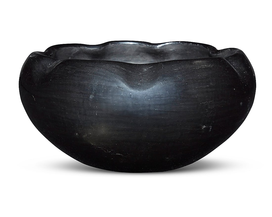 Desideria Montoya Sanchez (1889-1982, San Ildefonso Pueblo), A blackware pottery bowl: Desideria Montoya Sanchez (1889-1982, San Ildefonso Pueblo) A blackware pottery bowl With piecrust crimped rim Incised signature to underside: Desideria Height 3 3/4 in., diameter 8 1/4 in.