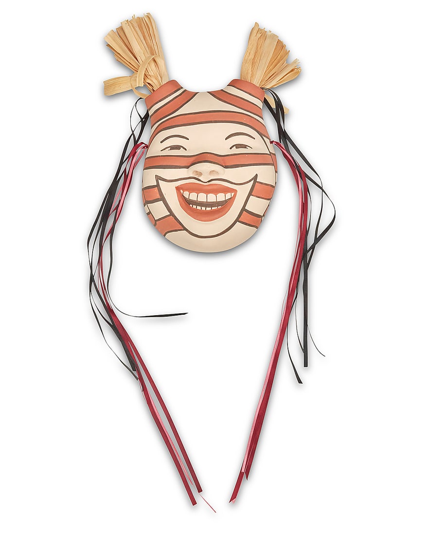 Kathleen Wall (b. 1973, Jemez Pueblo): Kathleen Wall (b. 1973, Jemez Pueblo) A polychrome Koshare pottery wall mask with ribbon and removable corn husk accents Signed in slip verso: Kathleen Wall Height (excluding corn husks) 9 3/4 in., wi