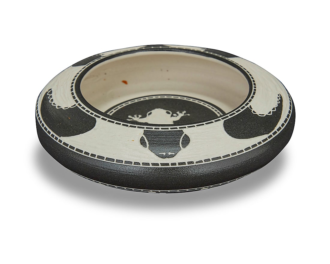 Patrick Leach (b. 20th century, Snuneymuxw/Coast Salish), A sgraffito pottery low bowl, 2017: Patrick Leach (20th century, Snuneymuxw/Coast Salish) A sgraffito pottery low bowl, 2017 With frog design to interior, turtle to exterior rim, and a banded geometric design of stacked steps to