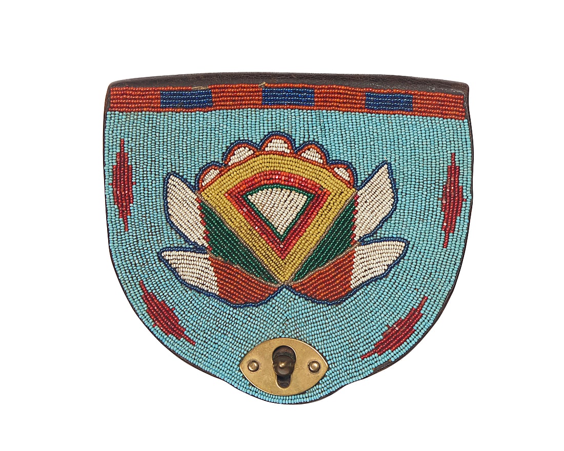 A Plateau beaded Benicia Arsenal leather shot pouch: A Plateau beaded Benicia Arsenal leather shot pouch Late 19th century The pouch originally for Dyer design carbine shot, the flap later beaded with a polychrome pictorial stylized floral and